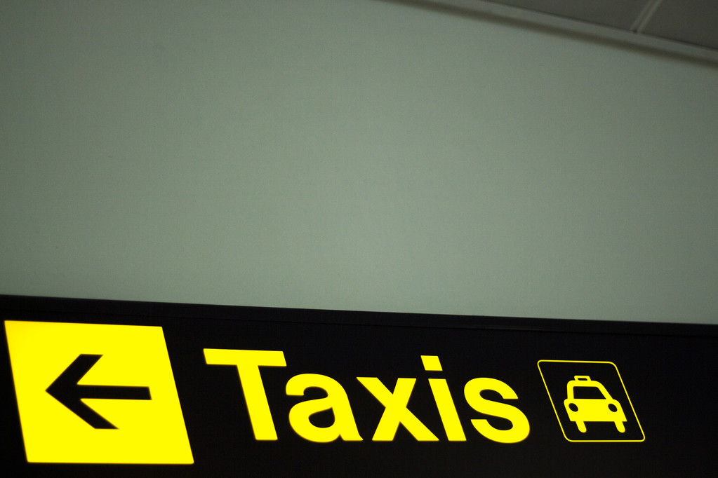 Airport information sign light panel giving directions in arrivals 