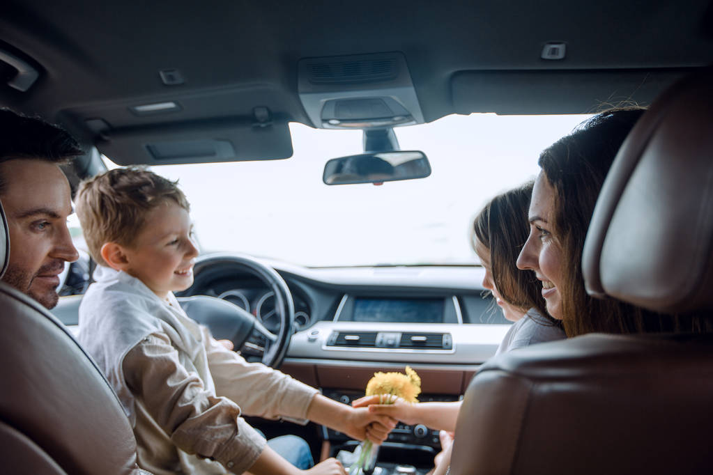Close-up view of family relaxing in a comfortable car