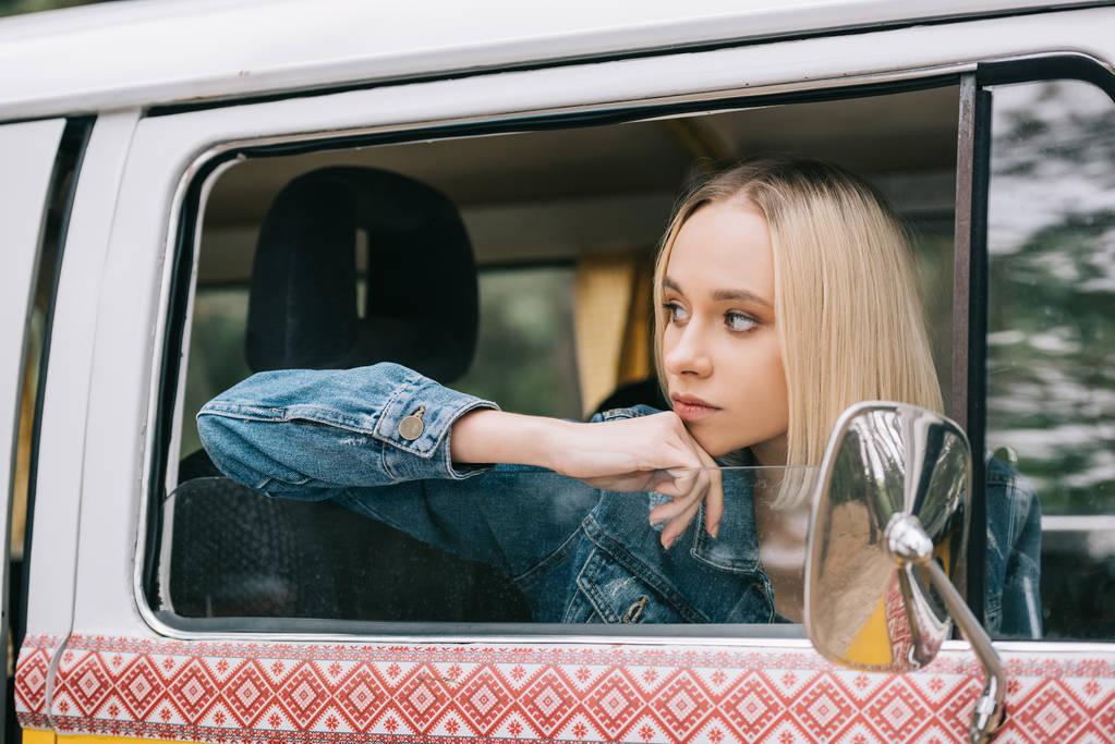 Girl traveller in minivan