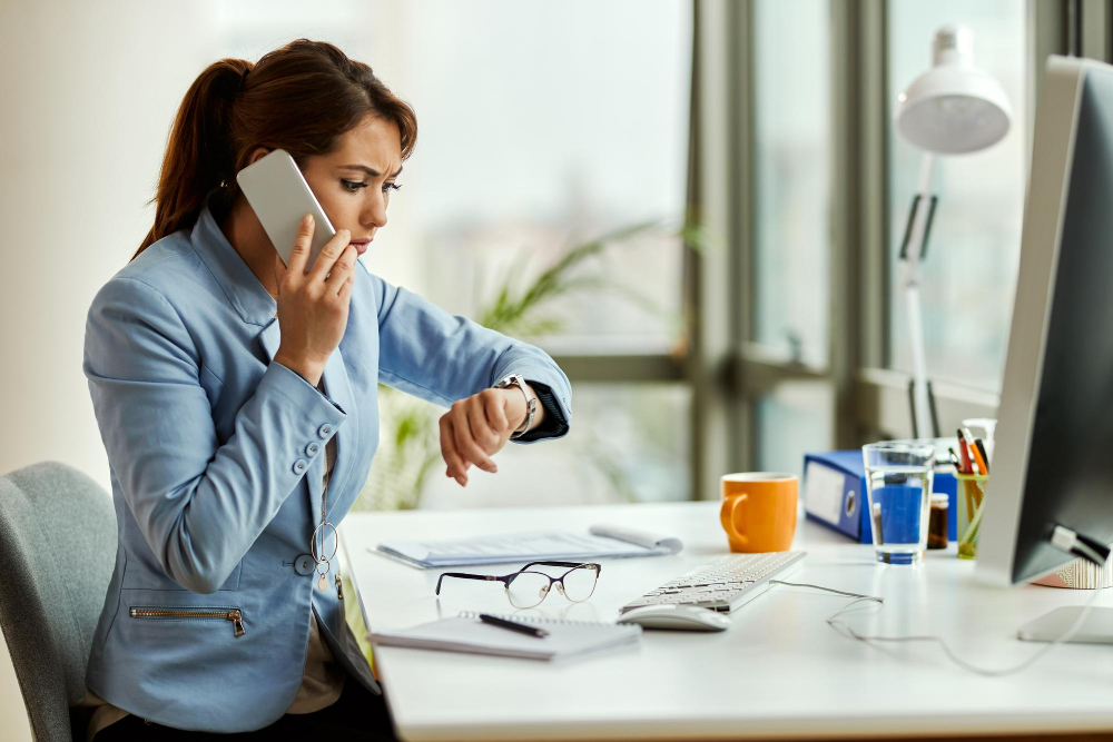 Woman watching time while on a phone call