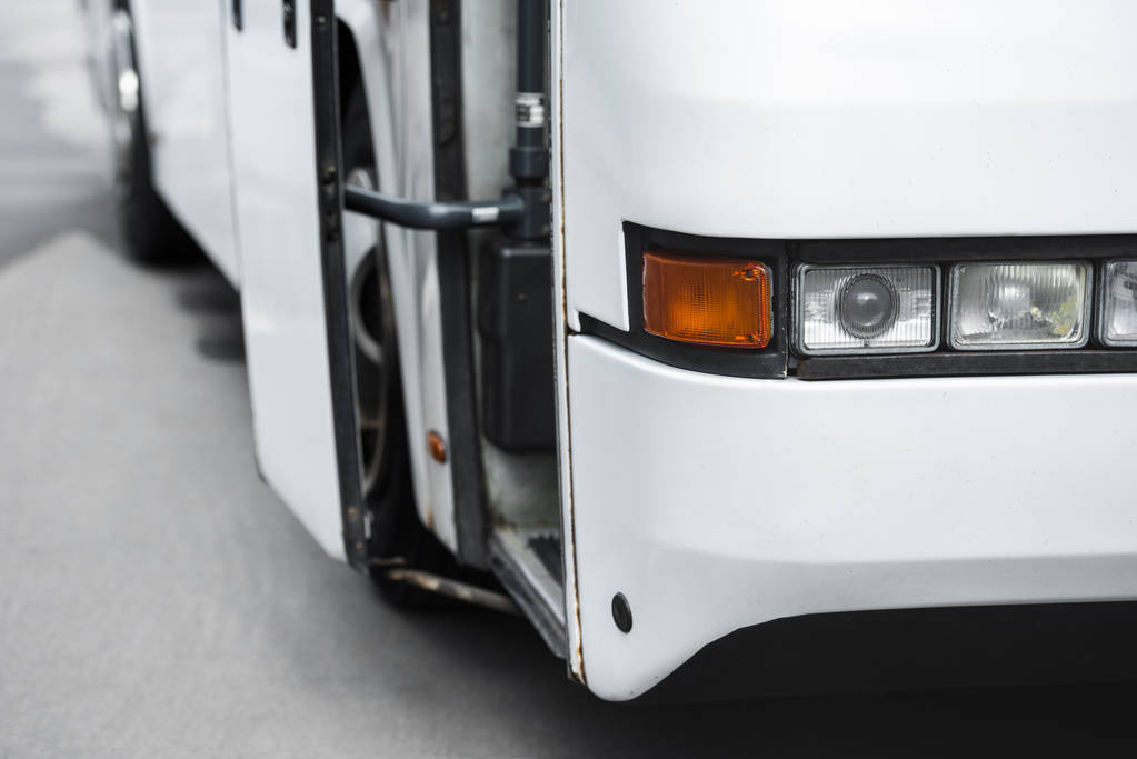 Close view of a white travel bus