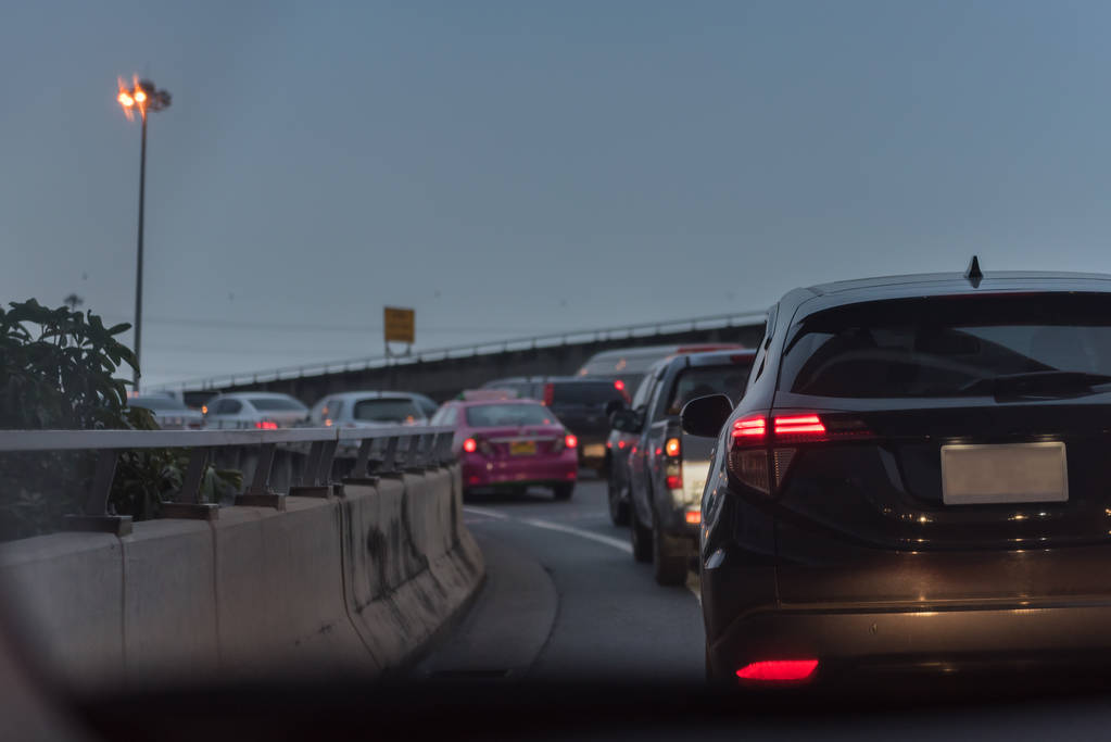 traffic jam with row of car on toll way, rush hour before rainning