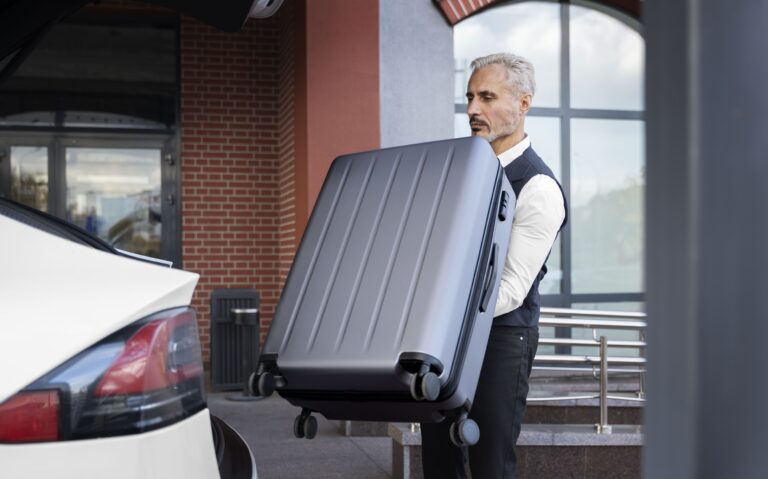 Driver-holding-baggage-side-view