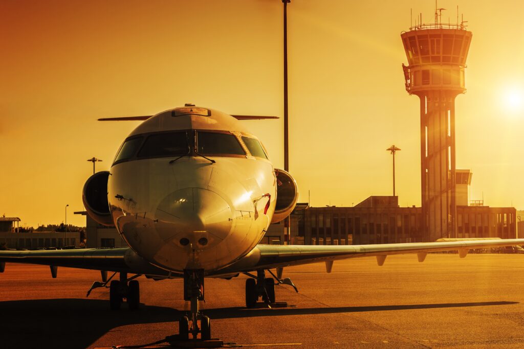 Plane at airport in sunset