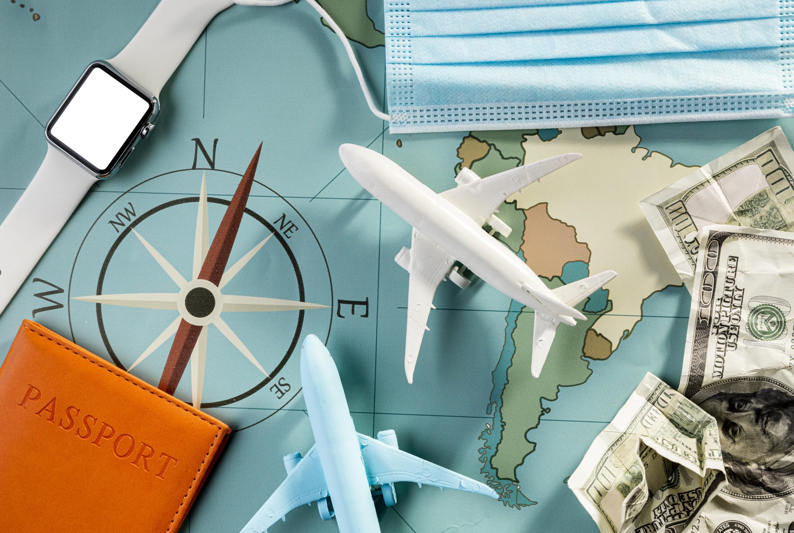top-view-airplane-figurines-with-smartwatch-medical-mask